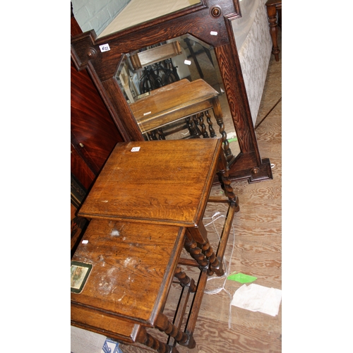 622 - Nest of three oak barley twist tables together with an oak framed arts and crafts mirror, mirror ove... 