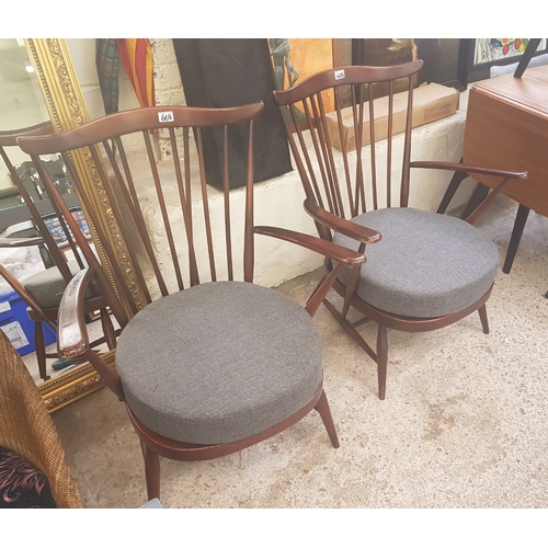 668 - Two Ercol 359 open easy chairs (2).