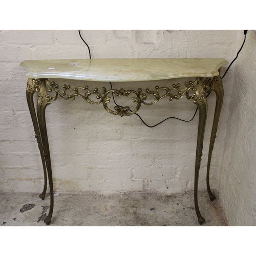 580 - An onyx topped brassed console table 92cm W x 28cm D x 69cm H.