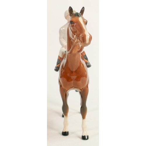 235 - Beswick jockey on bay horse 1862, light blue racing colours, over painted jacket.