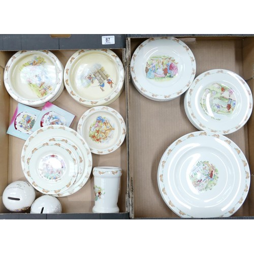 87 - Royal Doulton Bunnykins items to include - dinner plates, salad plates, oatmeal dishes, money boxes ... 