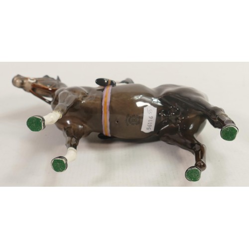 237 - Beswick jockey on Charcoal horse 1862, two broken legs and chip to hat.