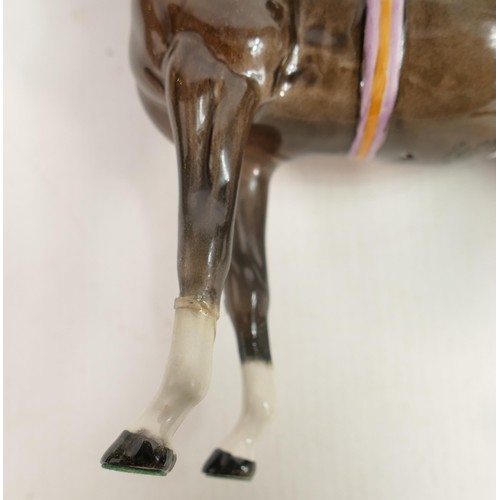 237 - Beswick jockey on Charcoal horse 1862, two broken legs and chip to hat.