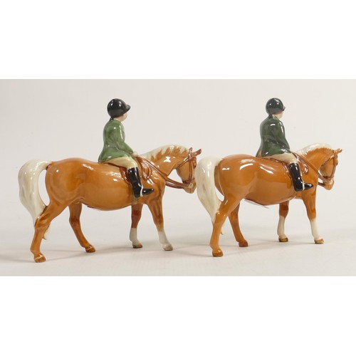 239 - Two Beswick boy on Palomino pony 1500, one with leg a/f & one with chip to hat & chip to ear (2)