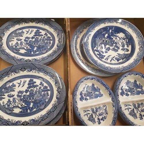 428 - A collection of Churchill branded blue and white 'Willow' pattern serving ware (2 trays).