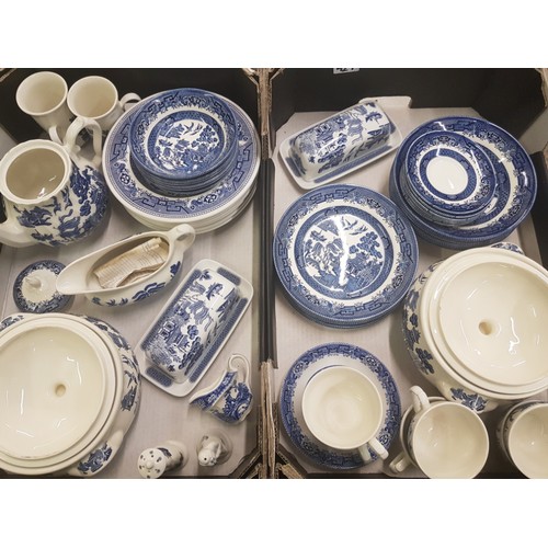 429 - A collection of blue and white 'Willow' pattern tea, dinner and serving ware, including Churchill br... 