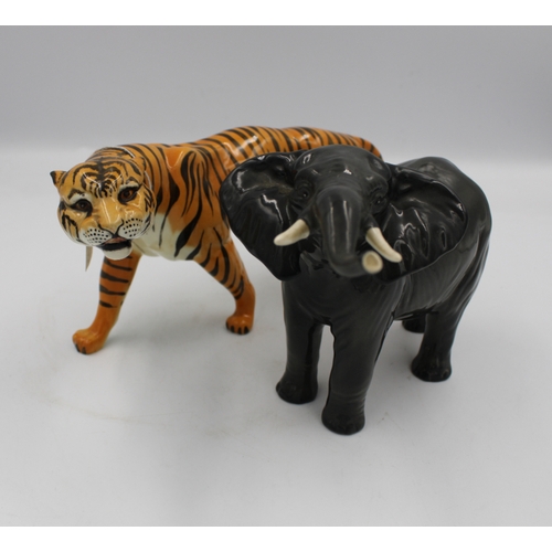 489 - Beswick Tigress 1486 together with a Beswick Elephant 974 (2).