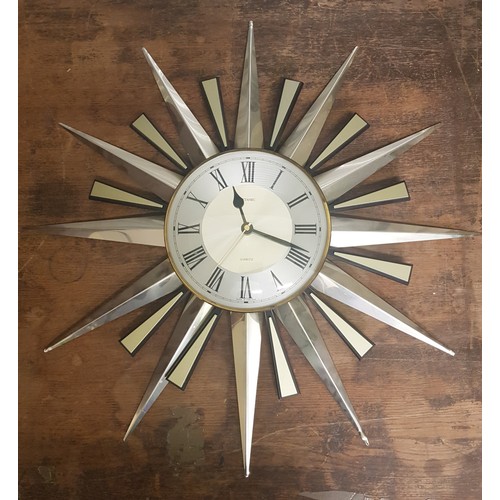 600 - Vintage Metamec 'Sunburst' quartz wall clock. In working order.