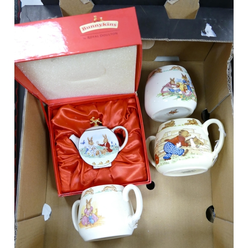 554 - Royal Doulton Bunnykins Boxed Forever Young Miniature teapot together with 3 similar handled mugs(4)