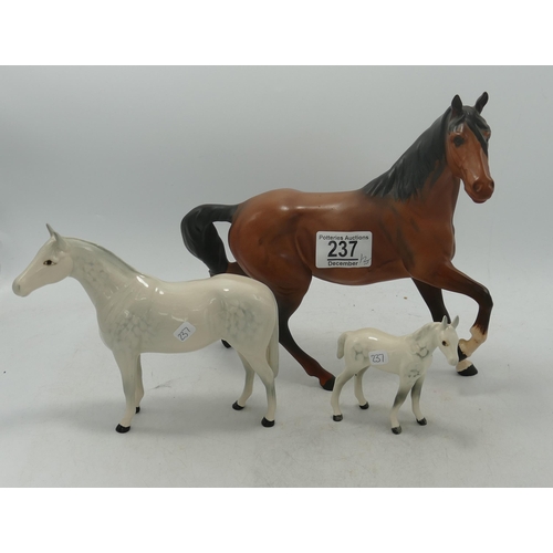 237 - Beswick Spirit of wind 2689 together with small thoroughbred foal and a Royal Doulton Thoroughbred s... 