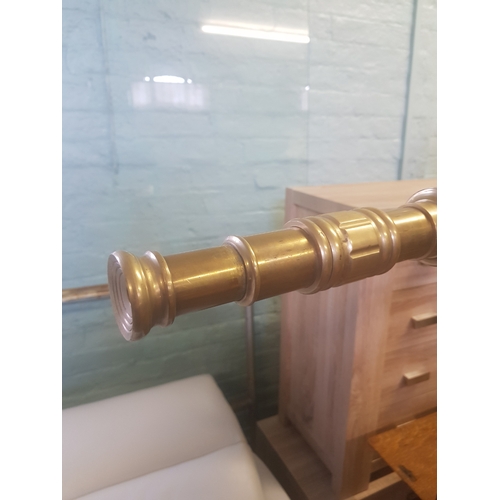 627 - Large brass telescope on brass bound mahogany tripod support, length of telescope 162cm.