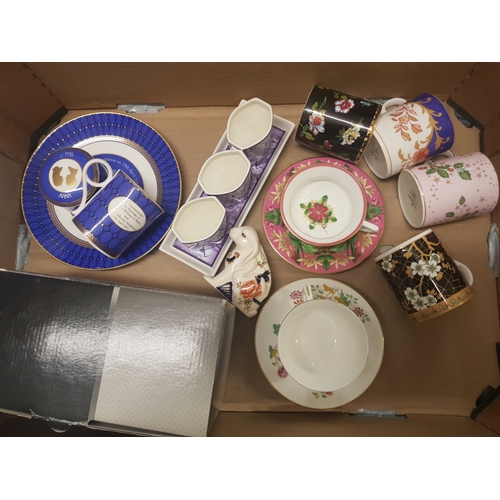 14 - A mixed collection of items to include Wedgwood Mugs & Saucers, Commemorative items, Coalport Candle... 