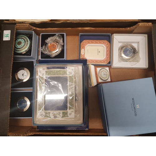 16 - A mixed collection of items to include Wedgwood Clocks & Photo frames, many boxed