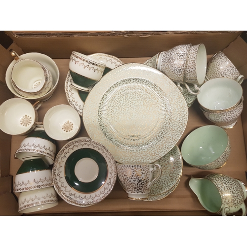 6 - A collection of green & gilt decorated tea ware