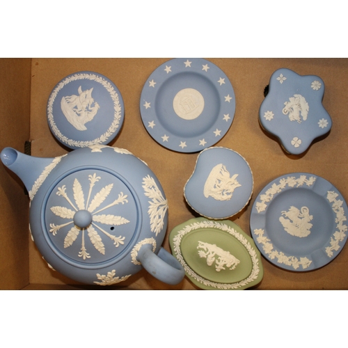 38 - A collection of Wedgwood Jasperware to include large teapot, lidded boxes, pin tray etc