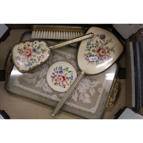 592 - 20th Century ladies 4 piece dressing table set, tray, mirror and 2 brushes.