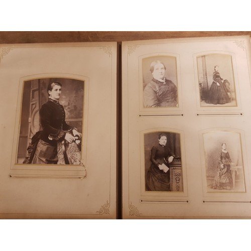 77 - A Victorian leather bound photo album (front cover detached but present).