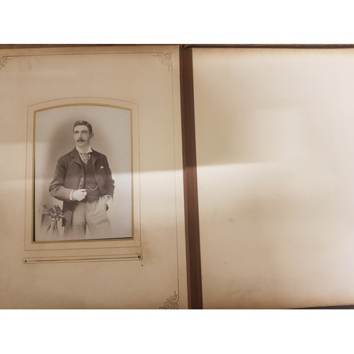 77 - A Victorian leather bound photo album (front cover detached but present).