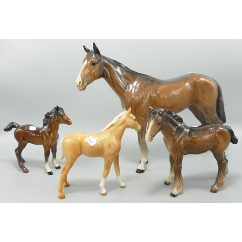 260 - Beswick Bois Roussel racehorse together with 1084 foal, shire foal ( both ears damaged) and a large ... 