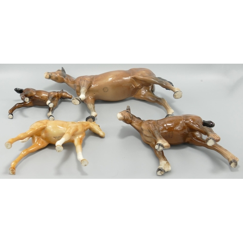 260 - Beswick Bois Roussel racehorse together with 1084 foal, shire foal ( both ears damaged) and a large ... 