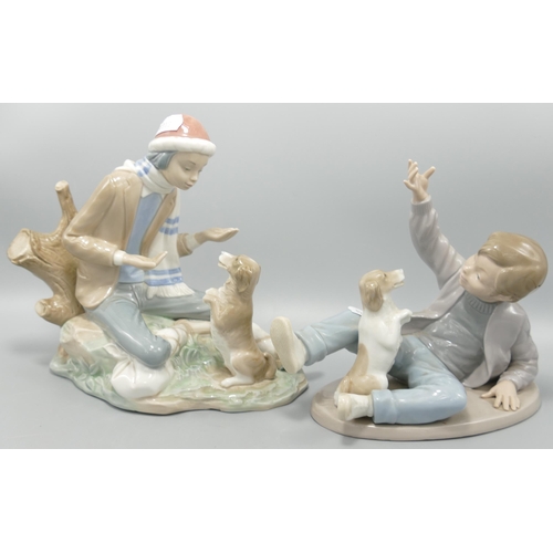 263 - Two Nao figures of a boy playing with a dog . Height of tallest 20cm