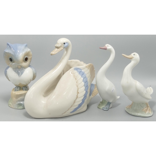 265 - Nao figure of a goose together with a similar figure of a goose and two Spanish figures one of a owl... 