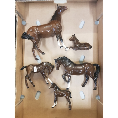 38 - A group of Royal Doulton Horse Figures to include swish tail horse, stocky jogging mare, 3 foals all... 