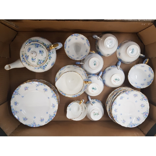 583 - Crown Staffordshire 'Forget me not' pattern tea and dinner ware items to include side plates, tea po... 