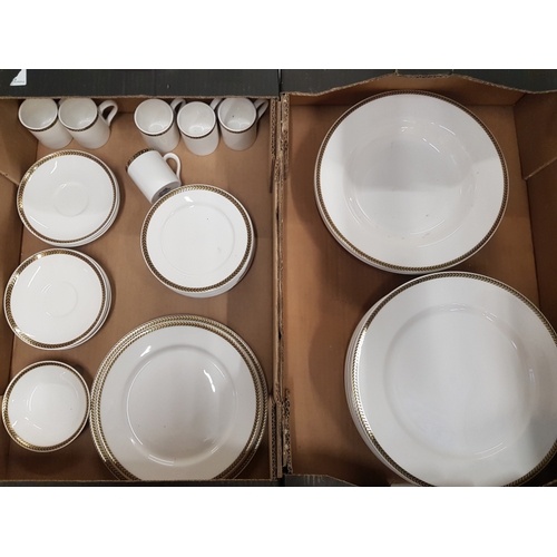 599B - A collection of Dudson dinner and coffee ware items, white with gold/black trim (2 trays).