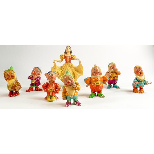 650 - A set of Wade first version Snow White and the Seven Dwarfs, c1930s in cellulose finish, some condit... 