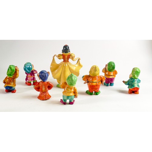 650 - A set of Wade first version Snow White and the Seven Dwarfs, c1930s in cellulose finish, some condit... 