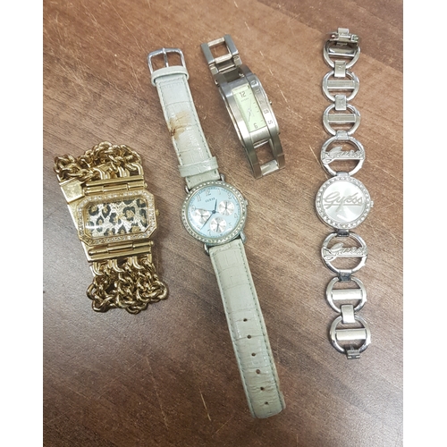 654 - Four various Ladies Guess designer wristwatches. (4)