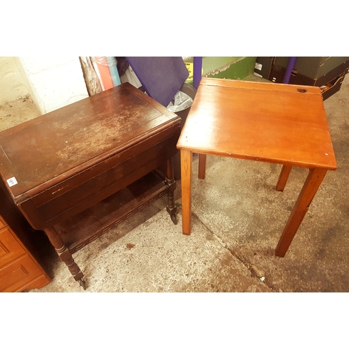 689 - A mid century single hinged-top school desk, together with an oak trolley table (2).