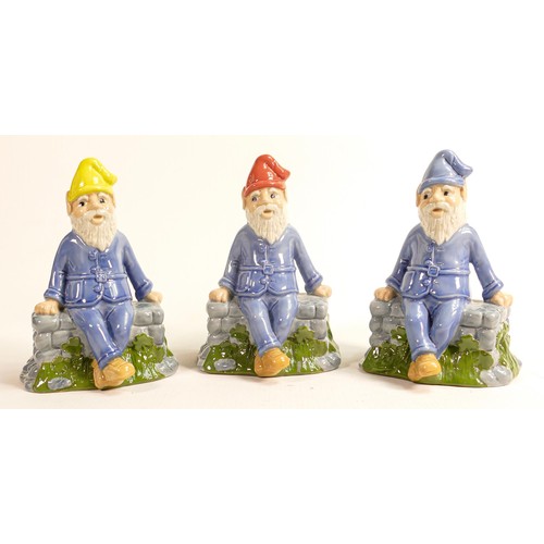 4 - Three Wade porcelain figures of seated pixies 'Lucky', each has a different coloured hat, signed and... 