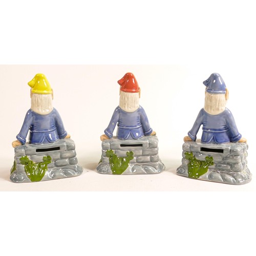 4 - Three Wade porcelain figures of seated pixies 'Lucky', each has a different coloured hat, signed and... 