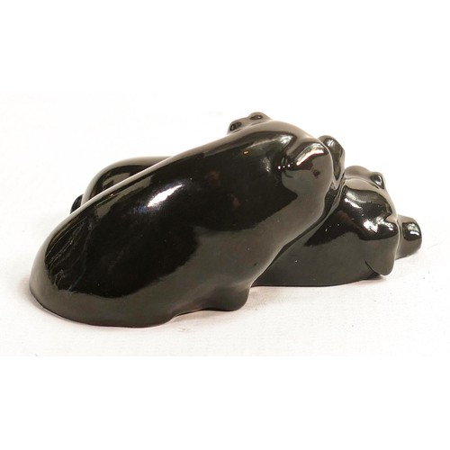 384 - Royal Doulton early pair of snoozing pigs, impressed model no. 62 in black gloss glaze, h.4 x L9.5cm... 