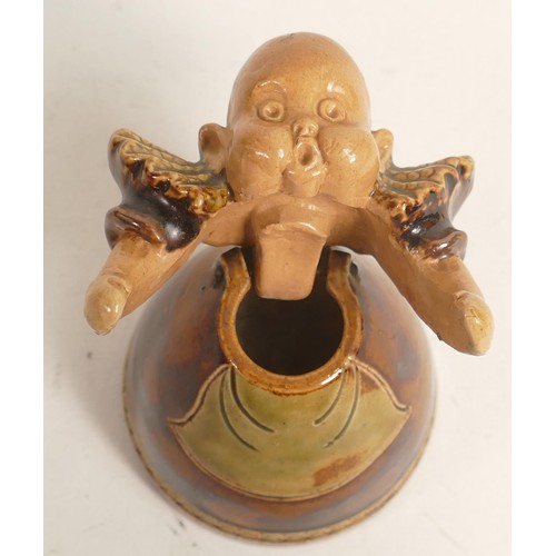 446 - Early 20th century Royal Doulton Lambeth stoneware inkwell modelled as a baby, h.9cm