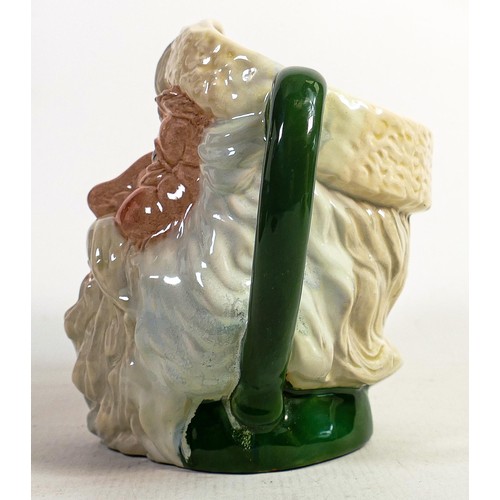 499 - Royal Doulton large character jugs - Santa Claus D6704, in a green colourway (restored) and a unmark... 