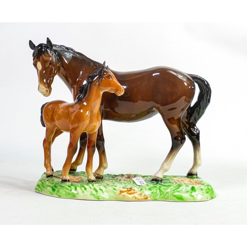 617 - Beswick model of brown mare and chestnut foal
953, on ceramic grassy base.