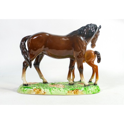 617 - Beswick model of brown mare and chestnut foal
953, on ceramic grassy base.