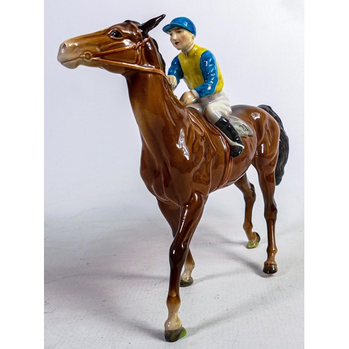 633 - Beswick jockey on walking horse 1037, yellow, white & blue jockey colours.