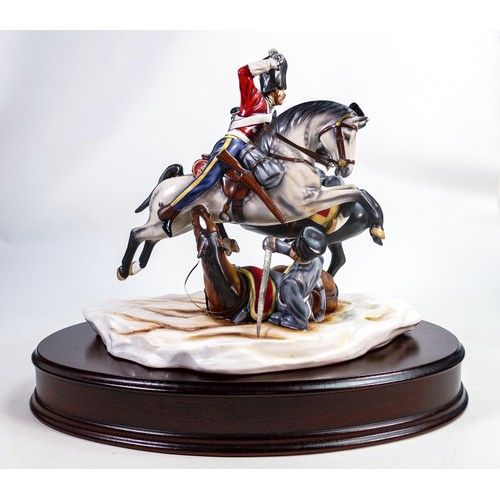 690 - A Michael Sutty limited edition porcelain military group 