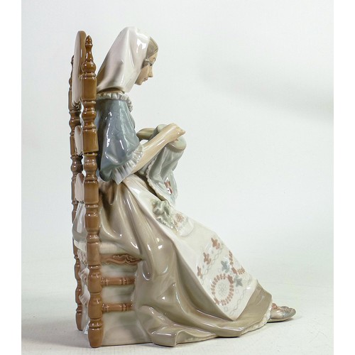 827 - Lladro lady seated in chair with embroidery stately figurine, height 27cm