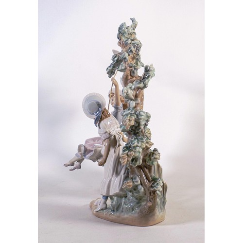 840 - Large Lladro figurine of two girls playing on a swing, 1366. Height 38cm - tip of ribbon broken off ... 