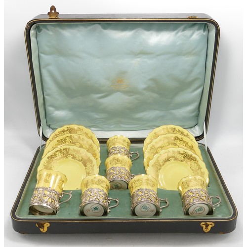 866 - Cased early 20th century Coalport cups & saucers set with ornate silver handles, 167g of silver.