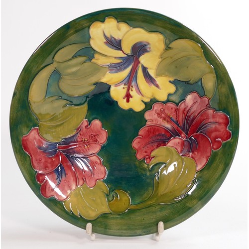 906 - Moorcroft Hibiscus on green bowl. Moorcroft potters to the late Queen Mary sticker to base. Diameter... 