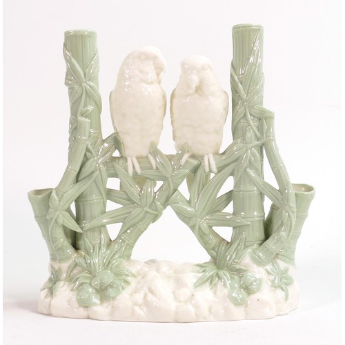 949 - Royal Worcester Aesthetic period green and white spill vase, in the form of two love birds perched o... 