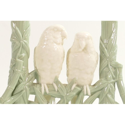 949 - Royal Worcester Aesthetic period green and white spill vase, in the form of two love birds perched o... 