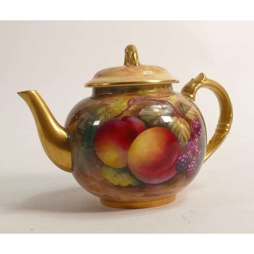 986 - Royal Worcester tea pot, gilded and hand painted with fruit by E Townsend, puce mark, h.15cm.