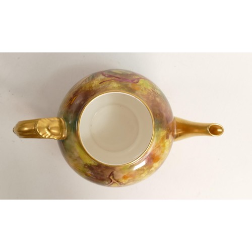 986 - Royal Worcester tea pot, gilded and hand painted with fruit by E Townsend, puce mark, h.15cm.